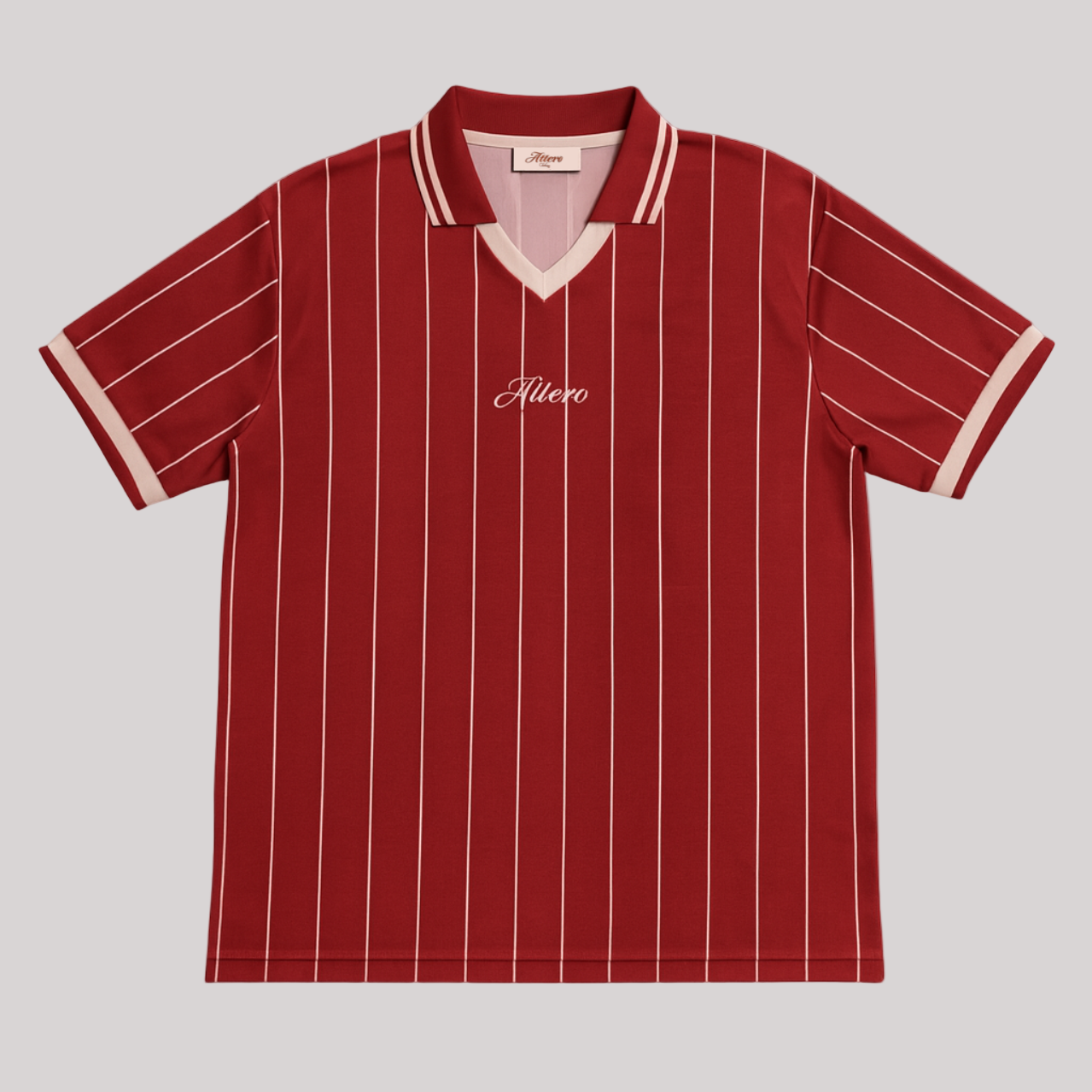 Burgundy ROMA retro jersey by Attero with thin vertical pinstripes and open collar, laid flat on a white background.